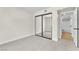 Light bright bedroom features carpeted floors, baseboard trim, large closet, and ensuite bathroom at 2964 Juniper Hills Blvd # 104, Las Vegas, NV 89142