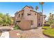 Attractive condo building with mature landscaping and a desert-style exterior at 2964 Juniper Hills Blvd # 104, Las Vegas, NV 89142