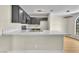 Open kitchen with counter seating, modern appliances, and trendy light fixtures at 2964 Juniper Hills Blvd # 104, Las Vegas, NV 89142