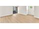 Bright living room with light wood floors, neutral walls and sliding door at 2964 Juniper Hills Blvd # 104, Las Vegas, NV 89142