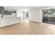 Open concept living space with light floors connecting kitchen and private balcony at 2964 Juniper Hills Blvd # 104, Las Vegas, NV 89142