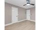 This bedroom features a modern ceiling fan, neutral paint, and light wood flooring at 3150 Soft Breezes Dr # 2186, Las Vegas, NV 89128