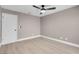 This bedroom features a modern ceiling fan, neutral paint, and light wood flooring at 3150 Soft Breezes Dr # 2186, Las Vegas, NV 89128