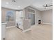 Bright kitchen features white cabinets, stainless steel appliances, and adjacent living area with fireplace at 3150 Soft Breezes Dr # 2186, Las Vegas, NV 89128