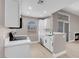 Modern kitchen with white cabinetry, stainless appliances, and an arch window offering natural light at 3150 Soft Breezes Dr # 2186, Las Vegas, NV 89128