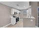 Bright kitchen featuring white cabinets, modern appliances, and an arched window for natural light at 3150 Soft Breezes Dr # 2186, Las Vegas, NV 89128