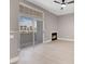 The spacious living room features a balcony and fireplace, creating a cozy space at 3150 Soft Breezes Dr # 2186, Las Vegas, NV 89128