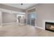 Bright living room with fireplace and sliding door access to a balcony at 3150 Soft Breezes Dr # 2186, Las Vegas, NV 89128