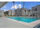 Enjoy the large community pool surrounded by lush landscaping and lounge seating at 3150 Soft Breezes Dr # 2186, Las Vegas, NV 89128