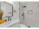 Modern bathroom featuring black hardware, a large mirror, and beautiful tile in the shower at 3151 Soaring Gulls Dr # 1179, Las Vegas, NV 89128