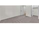 Neutral carpet in a bedroom featuring a walk-in closet and white door at 3151 Soaring Gulls Dr # 1179, Las Vegas, NV 89128