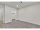Bright bedroom features neutral carpet, walk-in closet, and a doorway leading into another room at 3151 Soaring Gulls Dr # 1179, Las Vegas, NV 89128