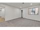 Bedroom featuring neutral carpet, a closet, and a doorway leading into another room at 3151 Soaring Gulls Dr # 1179, Las Vegas, NV 89128