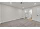 Bright bedroom featuring neutral carpet, a closet, and a doorway leading into another room at 3151 Soaring Gulls Dr # 1179, Las Vegas, NV 89128