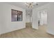 Bright dining room with hardwood floors, neutral walls and a view to an open kitchen at 3151 Soaring Gulls Dr # 1179, Las Vegas, NV 89128