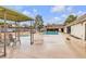 Community pool featuring a covered seating area and lounge chairs for relaxation and recreation at 3151 Soaring Gulls Dr # 1179, Las Vegas, NV 89128
