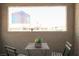 Cozy balcony with a table and chairs, offering a scenic view of the city skyline at 4200 S Valley View Blvd # 3053, Las Vegas, NV 89103