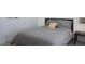 Modern bedroom featuring a bed with stylish pillows and a sleek nightstand with lamp at 4200 S Valley View Blvd # 3053, Las Vegas, NV 89103