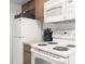 Bright kitchen with white appliances, wooden cabinetry, and ample counter space at 4200 S Valley View Blvd # 3053, Las Vegas, NV 89103