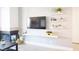 Comfortable living room with wall-mounted TV, floating shelves, and modern décor at 4200 S Valley View Blvd # 3053, Las Vegas, NV 89103