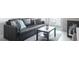 Modern living room with stylish black couch, coffee table, and sliding glass doors to an outside balcony at 4200 S Valley View Blvd # 3053, Las Vegas, NV 89103