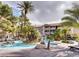 Relaxing community pool with palm trees, rock features and lounge chairs for relaxing by the water at 4200 S Valley View Blvd # 3053, Las Vegas, NV 89103
