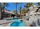 A stunning pool with rock waterfall feature and tropical landscaping; a true oasis at 4200 S Valley View Blvd # 3053, Las Vegas, NV 89103