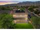 An elevated view of the backyard, mountains, surrounding neighborhood, and rooftop solar panels at 4905 Apache Valley Ave, Las Vegas, NV 89131