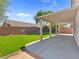 Low maintenance backyard with artificial grass and a covered patio, great for relaxing outdoors at 4905 Apache Valley Ave, Las Vegas, NV 89131