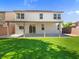 Lush artificial grass in the backyard with a covered patio perfect for outdoor relaxation at 4905 Apache Valley Ave, Las Vegas, NV 89131