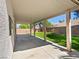 Cozy outdoor living with a covered patio and a beautiful, low-maintenance artificial grass backyard at 4905 Apache Valley Ave, Las Vegas, NV 89131