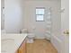 Bathroom with a toilet, a tub, shower, and a vanity at 4905 Apache Valley Ave, Las Vegas, NV 89131