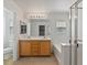 Bright bathroom featuring dual sinks, bathtub, and a separate glass-enclosed shower at 4905 Apache Valley Ave, Las Vegas, NV 89131