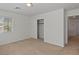 Bright bedroom features neutral walls, plush carpet, and a closet with sliding doors at 4905 Apache Valley Ave, Las Vegas, NV 89131