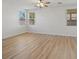 Bedroom featuring wood-look floors, natural lighting, and neutral walls that provide a bright space at 4905 Apache Valley Ave, Las Vegas, NV 89131