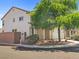 Inviting two-story home featuring a charming, landscaped yard and a welcoming, covered entry, plus an attached garage at 4905 Apache Valley Ave, Las Vegas, NV 89131