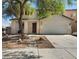 Attractive home with a two-car garage, well-manicured landscaping, and a welcoming entrance at 4905 Apache Valley Ave, Las Vegas, NV 89131