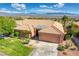 Aerial view capturing the home's front exterior, desert landscaping, and spacious driveway at 522 Via Ventana Dr, Mesquite, NV 89027