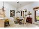 Elegant dining room with seating for four, stylish decor, and outdoor views at 522 Via Ventana Dr, Mesquite, NV 89027