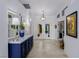 Bright foyer with elegant console table, decorative lamps, mirrors, and French doors at 522 Via Ventana Dr, Mesquite, NV 89027