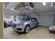 Clean, well-lit garage featuring an SUV, ample storage, and an automatic door at 522 Via Ventana Dr, Mesquite, NV 89027