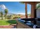 Backyard hot tub with mountain and golf course views, perfect for relaxation at 522 Via Ventana Dr, Mesquite, NV 89027