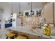 Bright kitchen featuring a granite island, bar seating, and ample cabinet space at 522 Via Ventana Dr, Mesquite, NV 89027