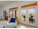 Bright living room with French doors and windows providing access to the patio and mountain views at 522 Via Ventana Dr, Mesquite, NV 89027