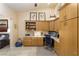 Home office with custom cabinets, workstation, and tiled floors at 522 Via Ventana Dr, Mesquite, NV 89027