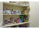 Organized pantry with shelves stocked with various food items and kitchen essentials at 522 Via Ventana Dr, Mesquite, NV 89027