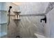 Walk-in shower features stylish tile, glass block accents, and a handheld shower head at 522 Via Ventana Dr, Mesquite, NV 89027