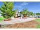 Backyard patio area with trees and barbeque at 544 N Fogg St, Las Vegas, NV 89110