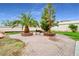 Backyard patio area with trees and barbeque at 544 N Fogg St, Las Vegas, NV 89110