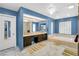 Bright bathroom featuring a soaking tub, glass shower, and dual-sink vanity at 544 N Fogg St, Las Vegas, NV 89110